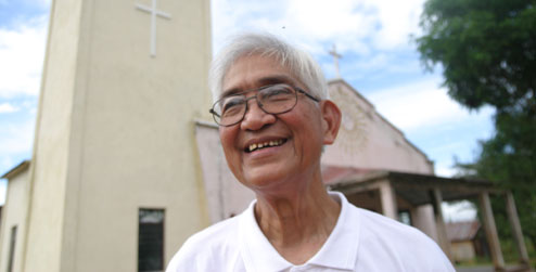 Portrait of Fr Samuel Dizon outside church in Timor-Leste