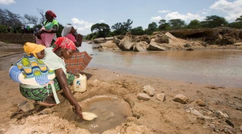 Pictured: Women collecting water in Zimbabwe, where a woman&#039;s role is often to become a wife and look after household chores. 